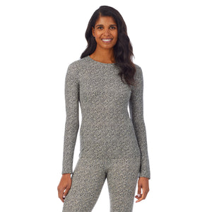 A lady wearing a cheetah long sleeve crew.