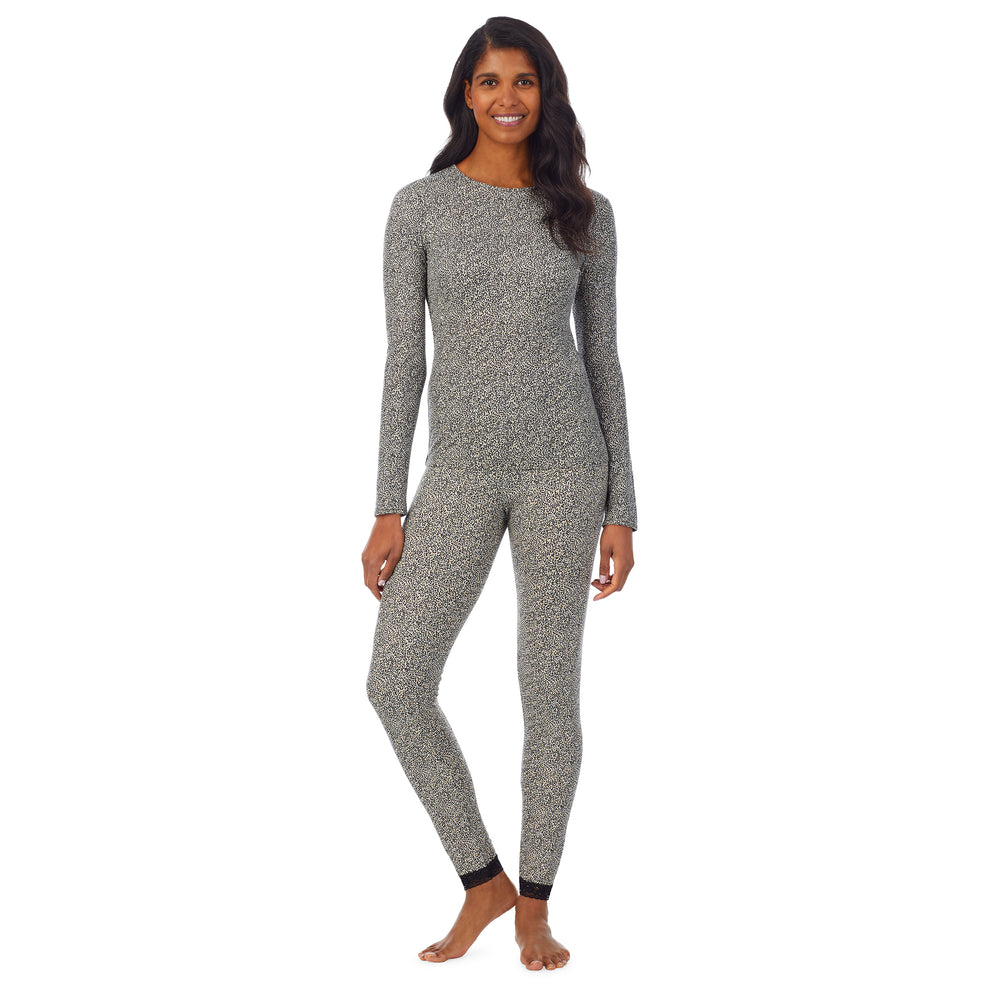 A lady wearing a cheetah long sleeve crew.