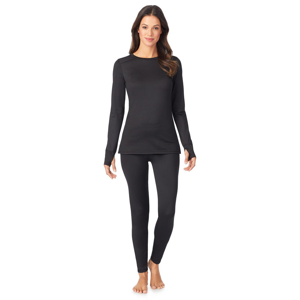 A lady wearing a  black long sleeve crew.