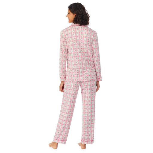 Pink Geo; Model is wearing size S. She is 5’9”, Bust 32”, Waist 24”, Hips 34.5”. @A lady wearing a long sleeve pajama set with pink geo pattern.
