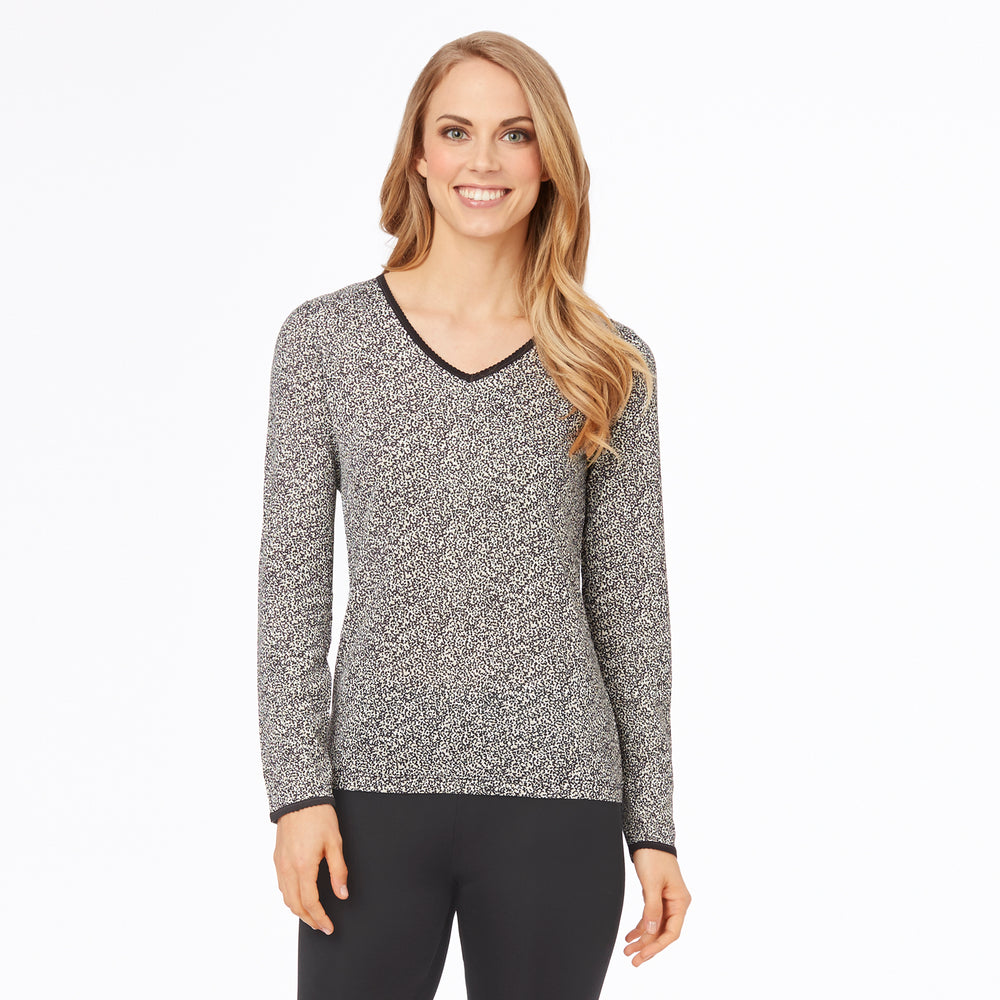 A lady wearing a cheetah long sleeve lace edge V-Neck.