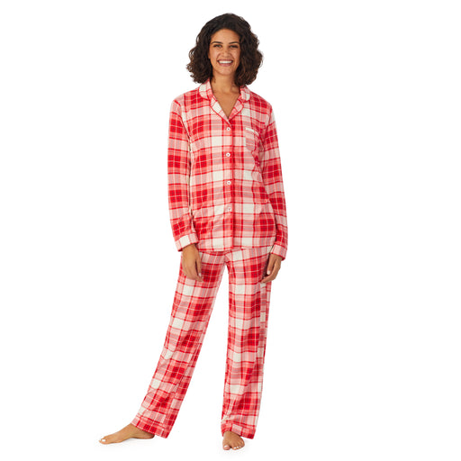 Red Ivory Plaid; Model is wearing size S. She is 5’9”, Bust 32”, Waist 24”, Hips 34.5”. @A lady wearing a white long sleeve pajama set with red ivory plaid.