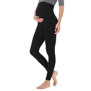 A lady wearing a black maternity legging. #Model is wearing a maternity bump.