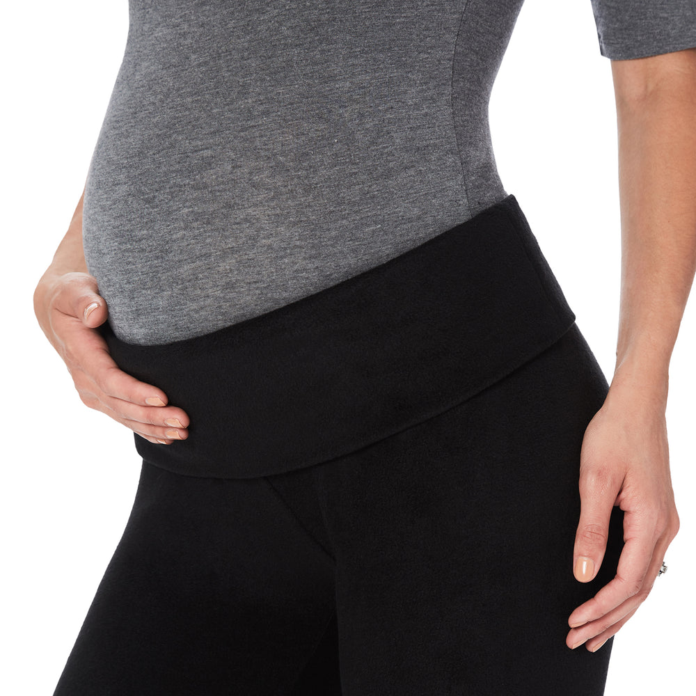 A lady wearing maternity legging #Model is wearing a black maternity bump.
