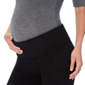 A lady wearing maternity legging #Model is wearing a black maternity bump.