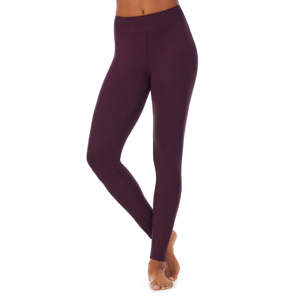A lady wearing a grape heather legging.