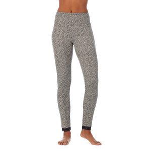 A lady wearing a cheetah lace edge legging.