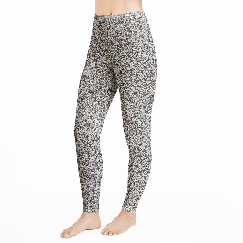 A lady wearing  a cheetah legging.
