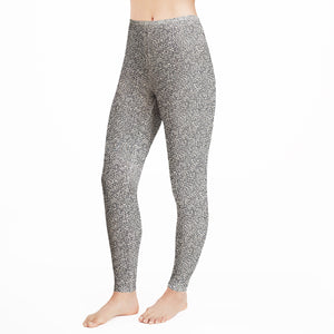 A lady wearing  a cheetah legging.