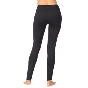 A lady wearing a black high-waisted legging.