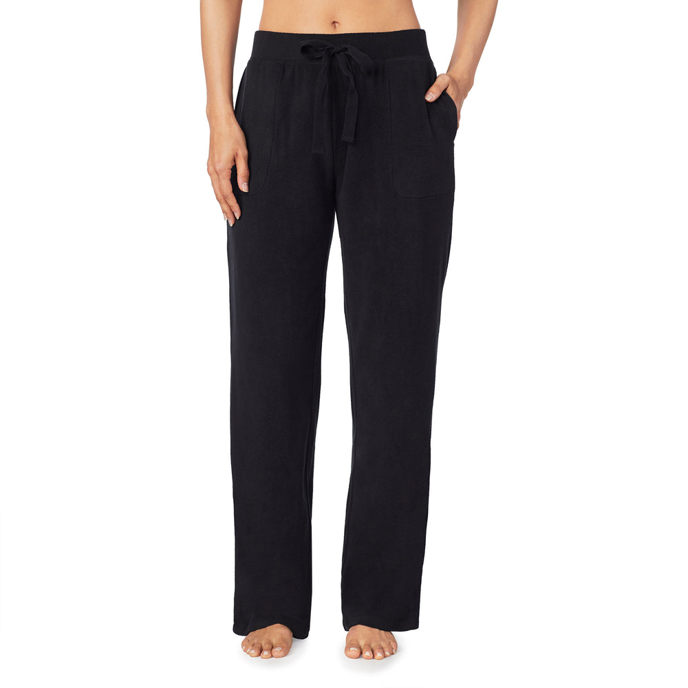 A lady wearing Fleecewear With Stretch Lounge Pant in Black side view side view