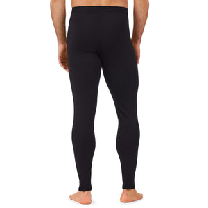 A man wearing a black X fleece pant.