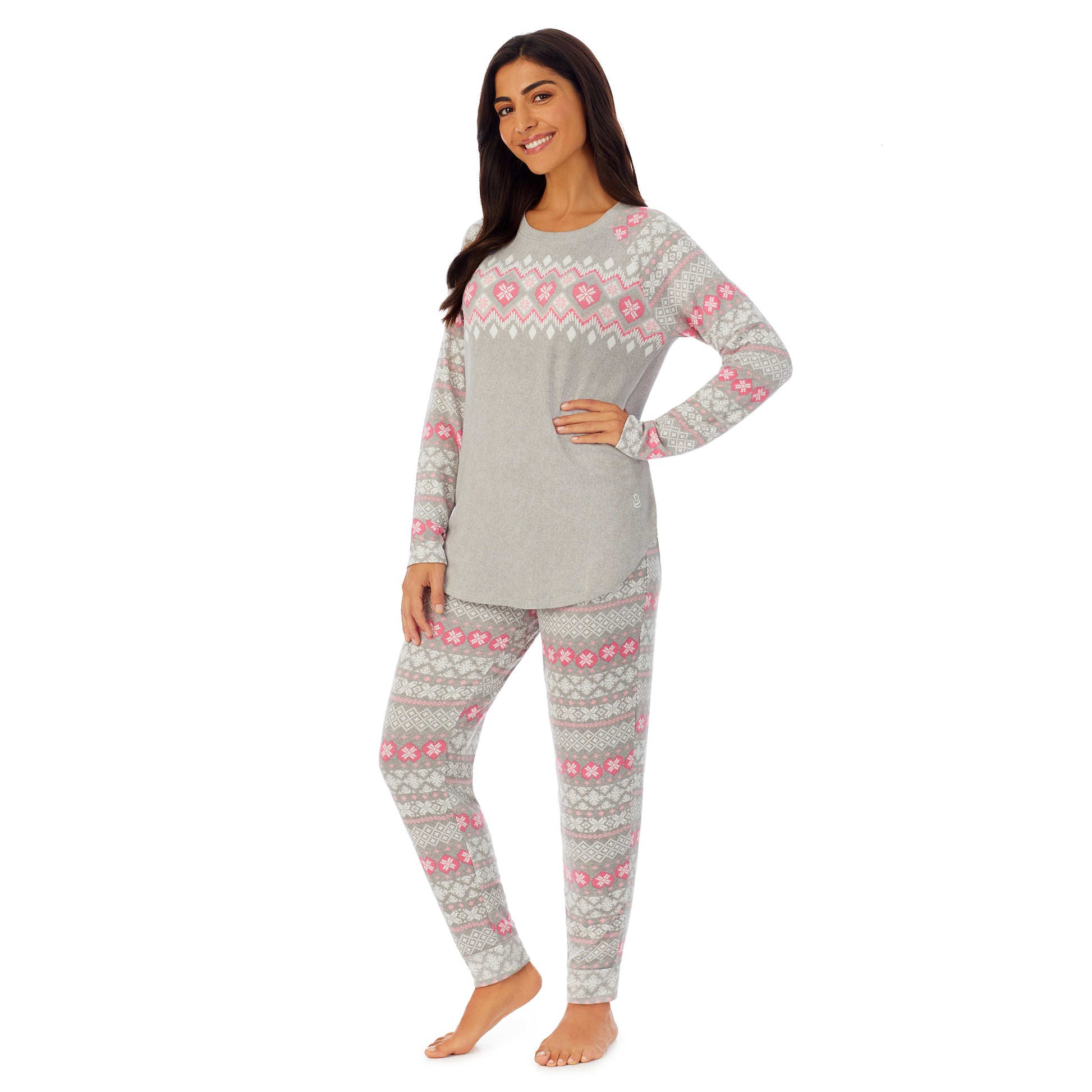 A lady wearing grey long sleeve pajama set with white and pink print