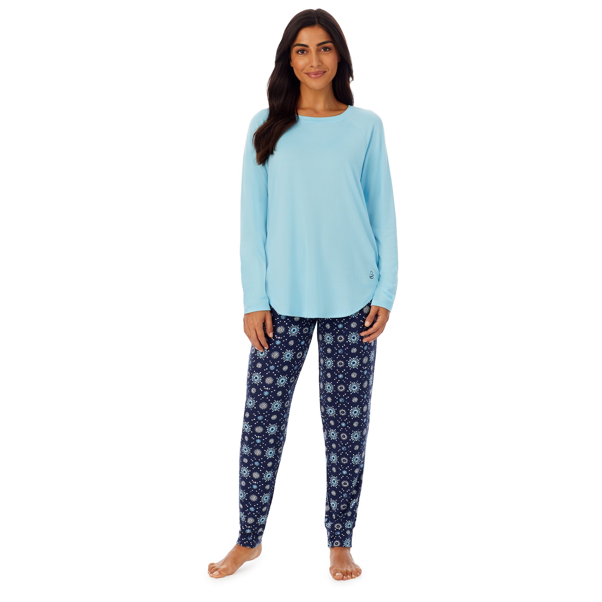 A lady wearing Blue long sleeve top and dark blue pajama set with white and blue print