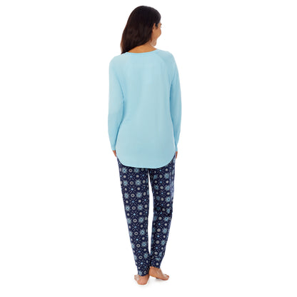 Navy Distressed Geo; Model is wearing size S. She is 5’7”, Bust 32”, Waist 25”, Hips 35”.@A lady wearing Blue long sleeve top and dark blue pajama set with white and blue print