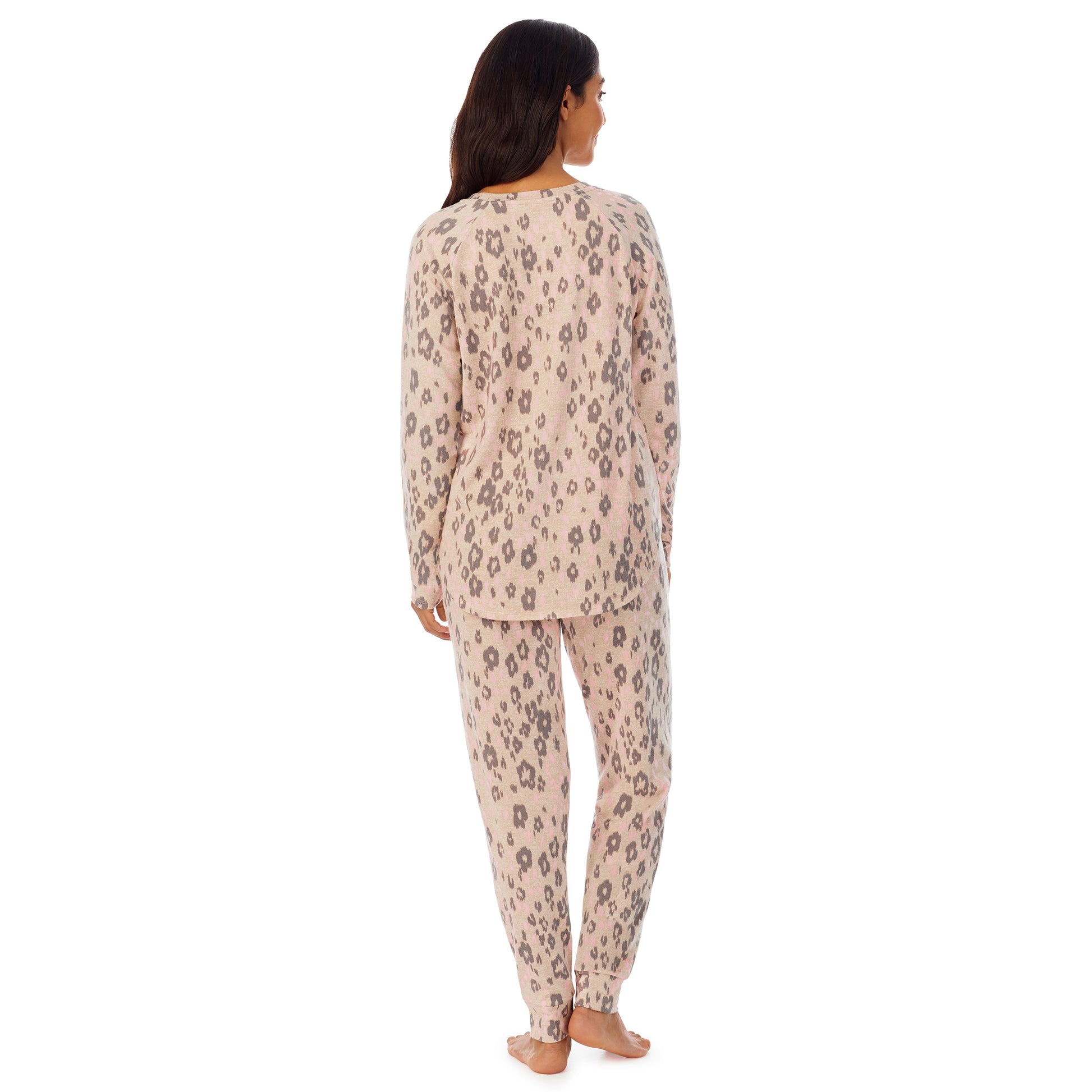 A lady wearing long sleeve pajama set with animal print