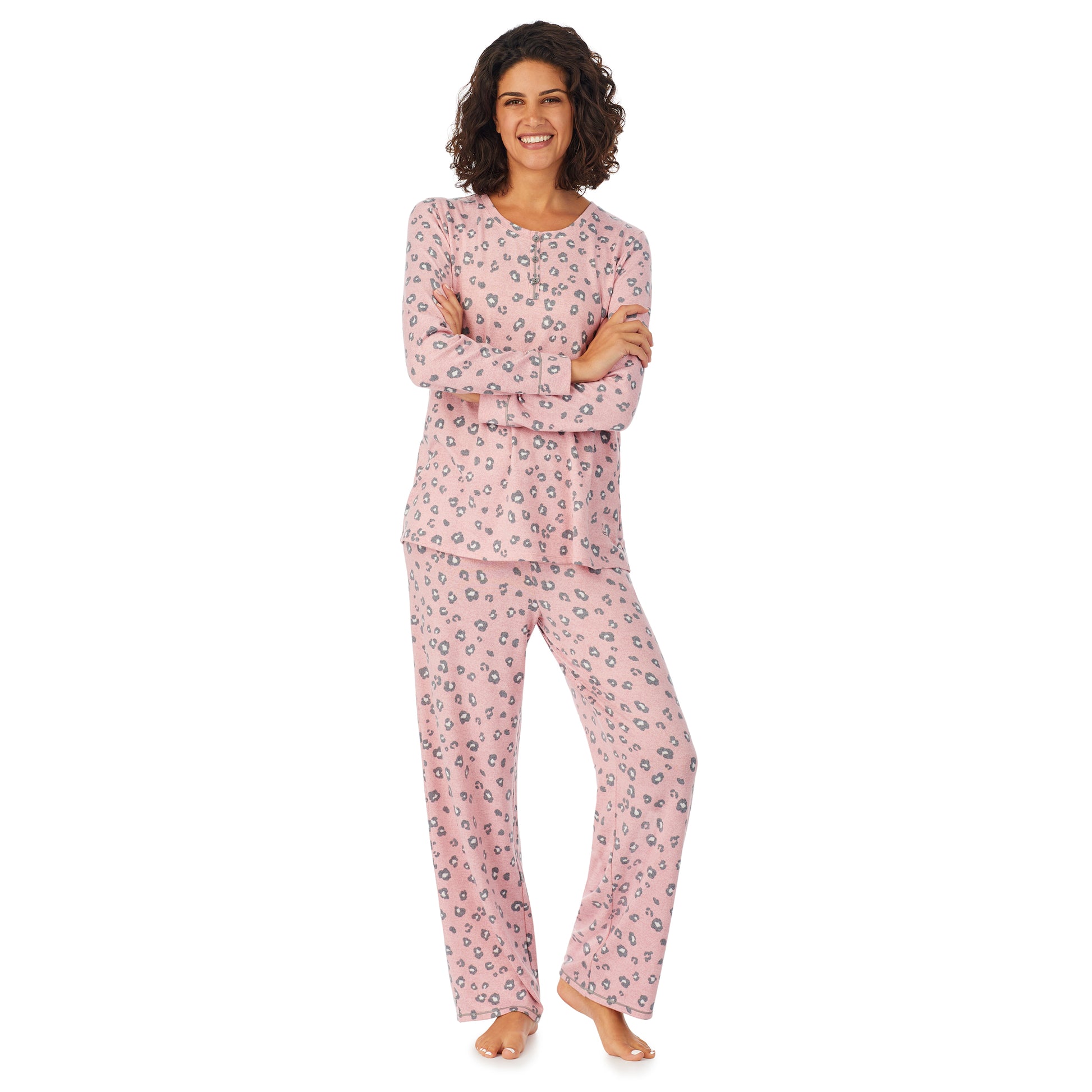 A lady wearing a pink long sleeve pajama set with pop animal pattern.