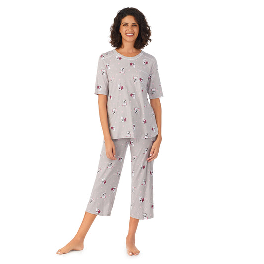 Grey Dot Dog; Model is wearing size S. She is 5’9”, Bust 32”, Waist 24”, Hips 34.5”. @A lady wearing a grey elbow sleeve cropped pajama set with dogs pattern.