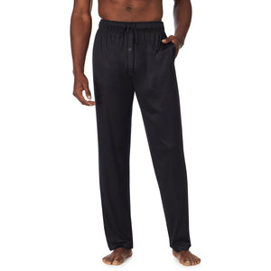  A lady wearingMens Far-Infrared Enhance Sleep Pant with Navy Olive Plaid print
