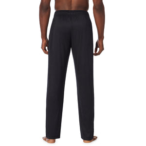  A lady wearingMens Far-Infrared Enhance Sleep Pant with Navy Plaid print