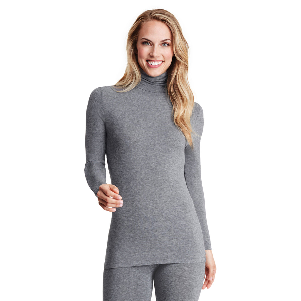 A lady wearing a charcoal heather long sleeve stretch tutleneck t-shirt.
