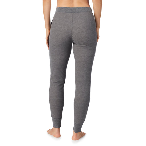 Stone Grey Heather; Model is wearing size S. She is 5’9”, Bust 32”, Waist 25.5”, Hips 36”. @A lady wearing a stone grey heather legging.