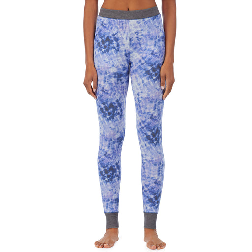 Blue Tie Dye; Model is wearing size S. She is 5’9”, Bust 32”, Waist 25.5”, Hips 36”. @A lady wearing a blue tie dye legging.