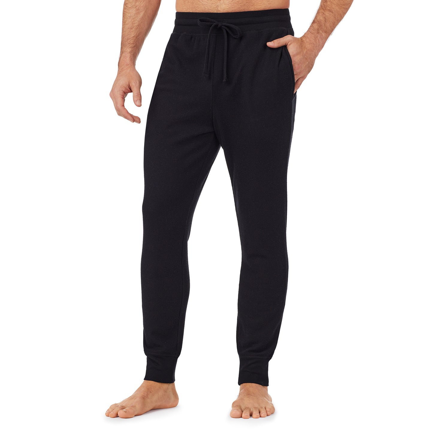 Black; Model is wearing size M. He is 6'1", Waist 31", Inseam 33". @A man wearing a black waffle thermal relaxed jogger pant.