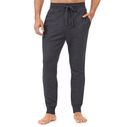 Charcoal Heather; Model is wearing size M. He is 6'1", Waist 31", Inseam 33". @A man wearing a charcoal heather waffle thermal relaxed jogger pant.