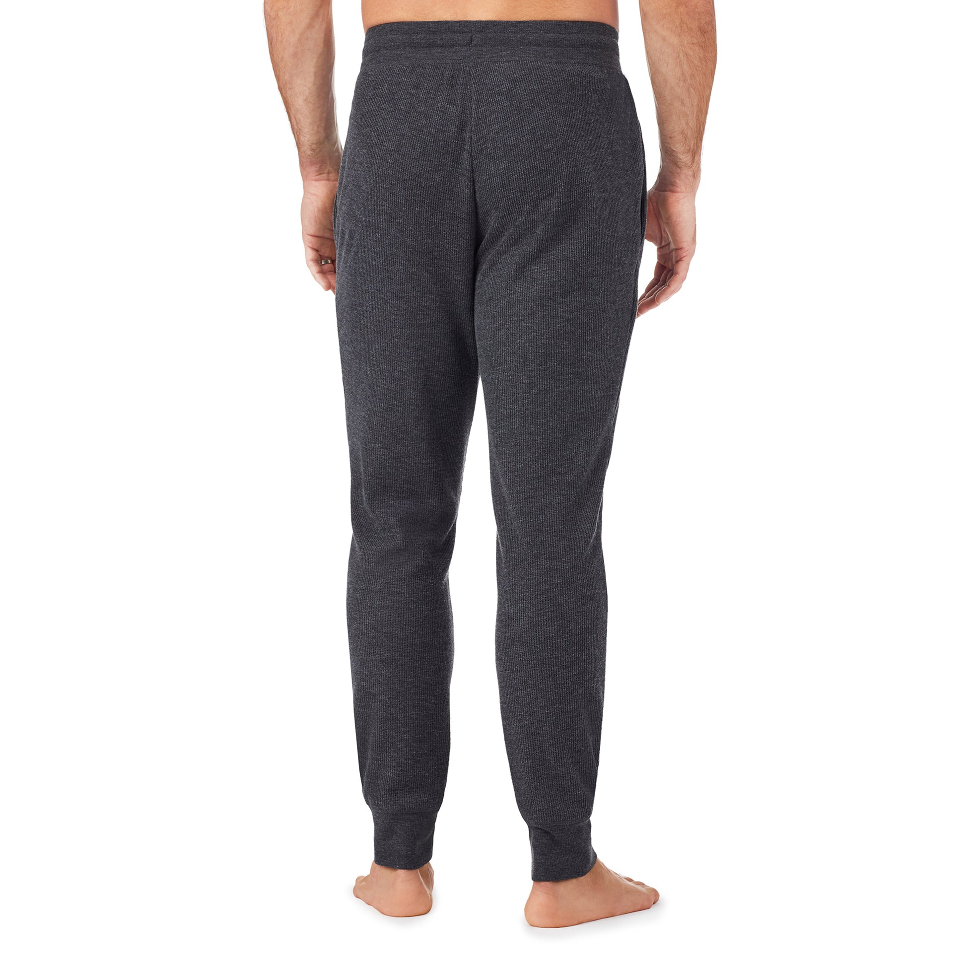 Charcoal Heather; Model is wearing size M. He is 6'1", Waist 31", Inseam 33". @A man wearing a charcoal heather waffle thermal relaxed jogger pant.
