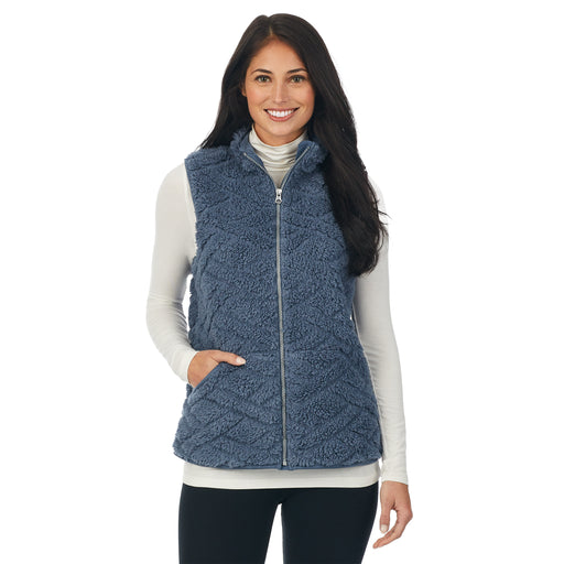 a lady wearing bluestone quilted cozy vest.