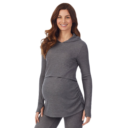 A lady wearing a stone grey heather long sleeve maternity hoodie top. #Model is wearing a maternity bump.