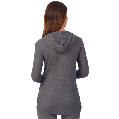 Stone Grey Heather; Model is wearing size S. She is 5’9”, Bust 34”, Waist 24.5”, Hips 36.5”. @A lady wearing a stone grey heather long sleeve maternity hoodie top. #Model is wearing a maternity bump.
