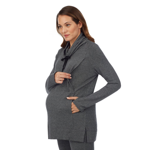 Charcoal Heather; Model is wearing a size S. She is 5’10”, Bust 34”, Waist 26”, Hips 36”. @A lady wearing a charcoal heather long sleeve funnel neck tunic. #Model is wearing a maternity bump.