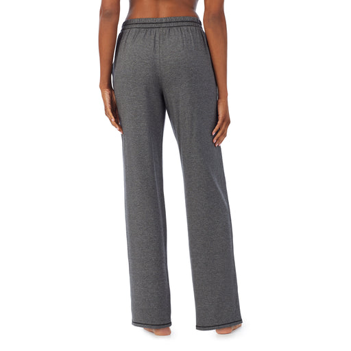 Charcoal Heather; Model is wearing size S. She is 5’10”, Bust 34”, Waist 24”, Hips 34”. @A lady wearing a charcoal heather lounge pant.