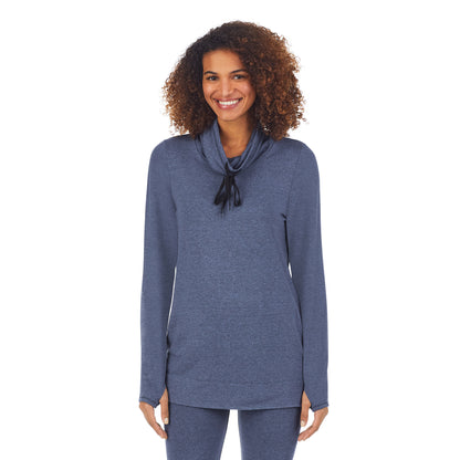 English Blue Heather;Model is wearing size S. She is 5’9”, Bust 32”, Waist 25”, Hips 35”.@A lady wearing english blue heather ultra cozy long sleeve cowl neck tunic.
