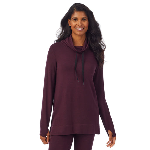 Grape Heather; Model is wearing size S. She is 5’10”, Bust 34”, Waist 24”, Hips 34”. @A lady wearing a grape heather long sleeve cowl neck tunic.