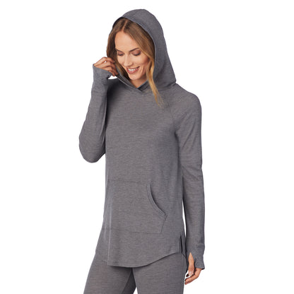 Stone Grey Heather; Model is wearing size S. She is 5’9”, Bust 32”, Waist 25.5”, Hips 36”. @A lady wearing a stone grey heather long sleeve hoodie tunic.