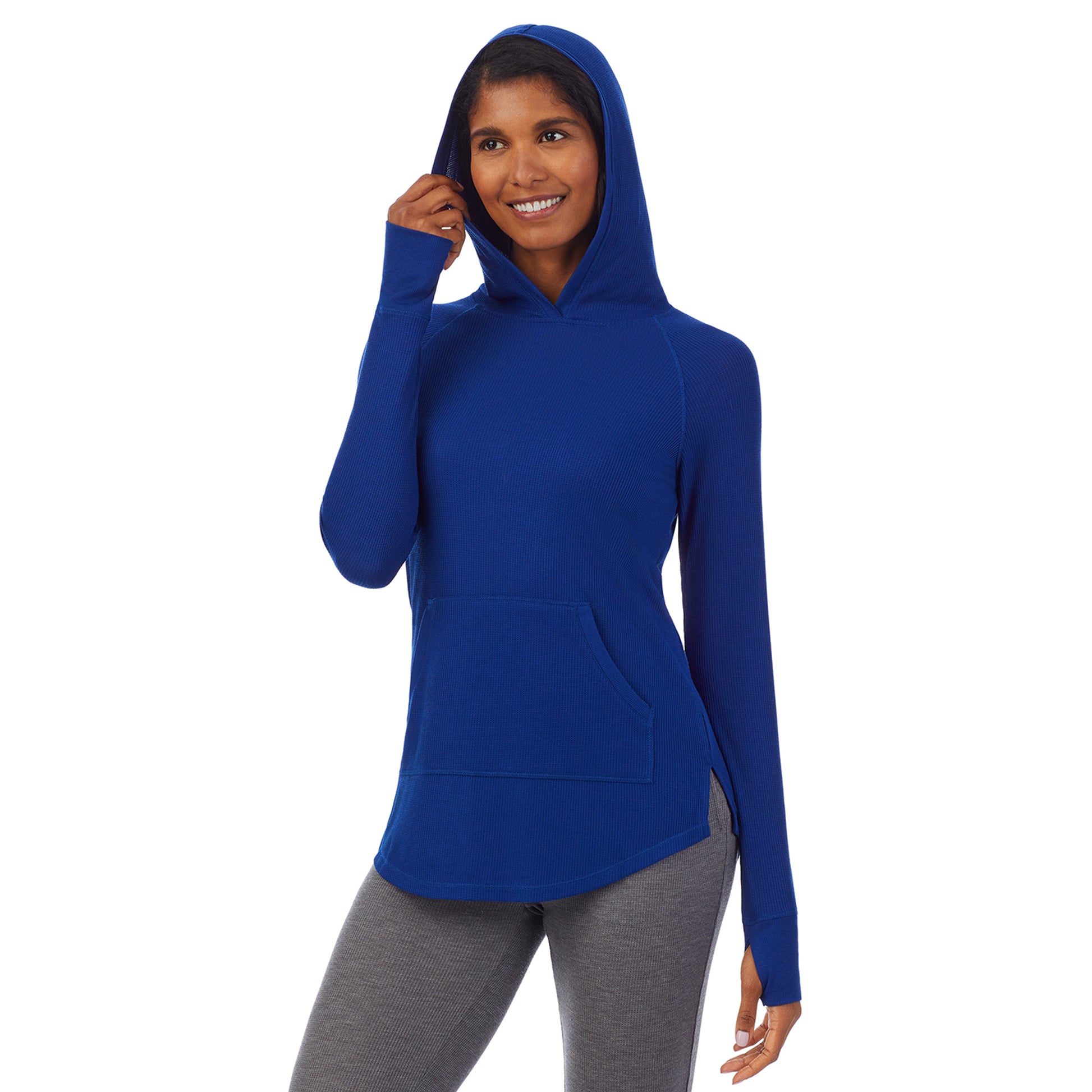 Royal Blue; Model is wearing size S. She is 5’10”, Bust 34”, Waist 24”, Hips 34”. @A lady wearing a royal blue long sleeve hoodie tunic.