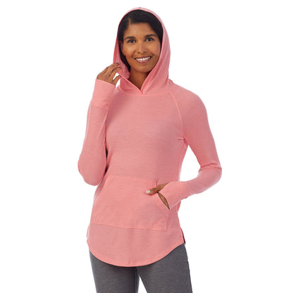 Bright Coral Heather; Model is wearing size S. She is 5’10”, Bust 34”, Waist 24”, Hips 34”. @A lady wearing a bright coral heather long sleeve hoodie tunic.
