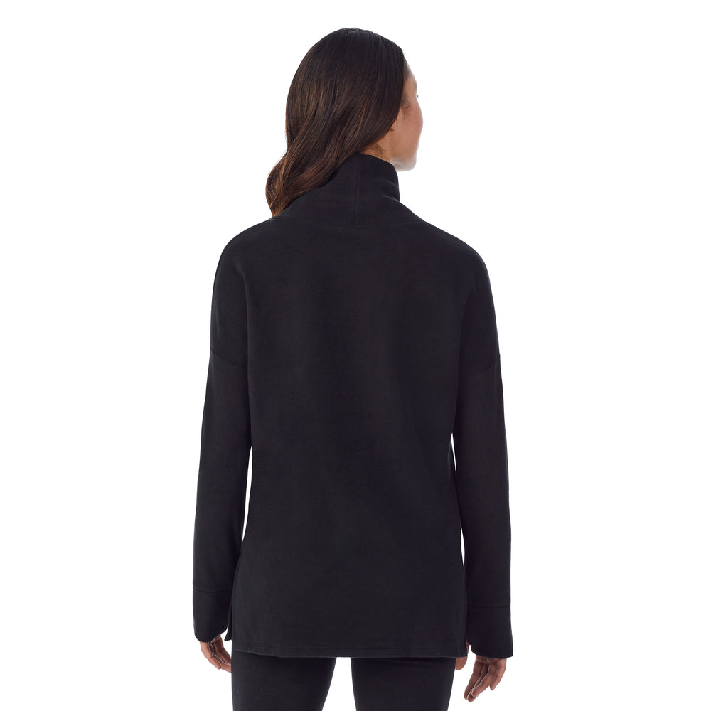 upper body of a lady wearing black long sleeve tunic