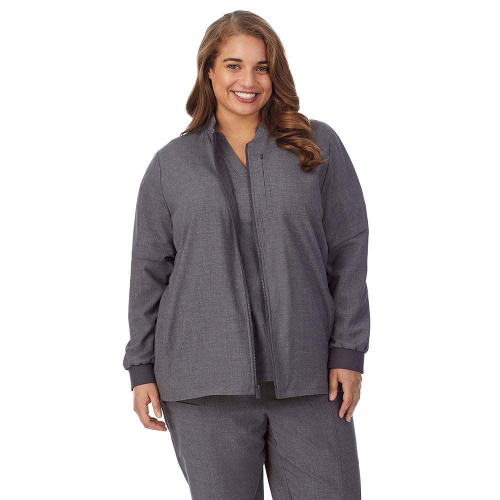 A lady wearing charcoal heather scrub jacket plus.