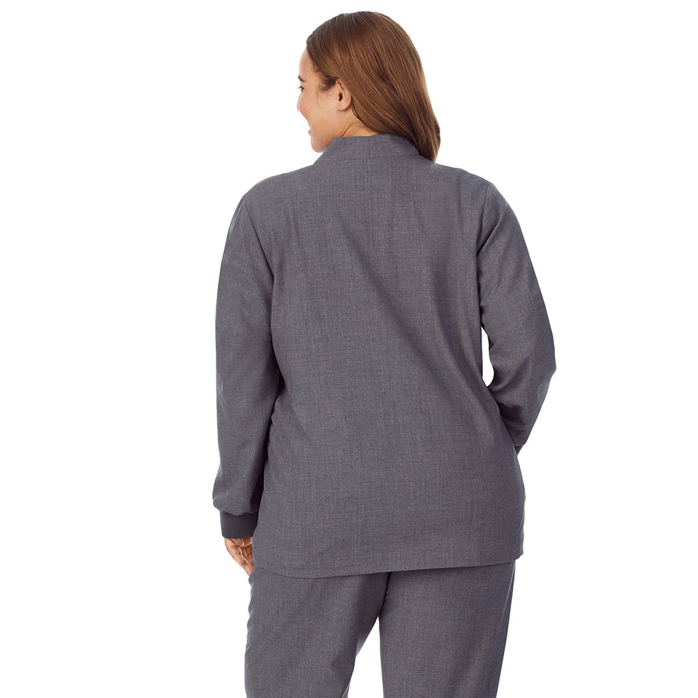 A lady wearing charcoal heather scrub jacket plus.