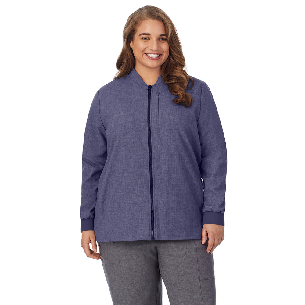 A lady wearing navy heather scrub jacket plus.