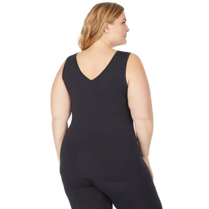 A lady wearing a black  sleeveless reversible tank plus.