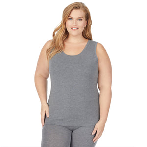 A lady wearing a charcoal heather sleeveless reversible tank plus.