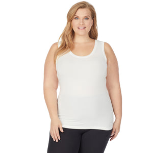 A lady wearing a ivory sleeveless reversible tank plus.
