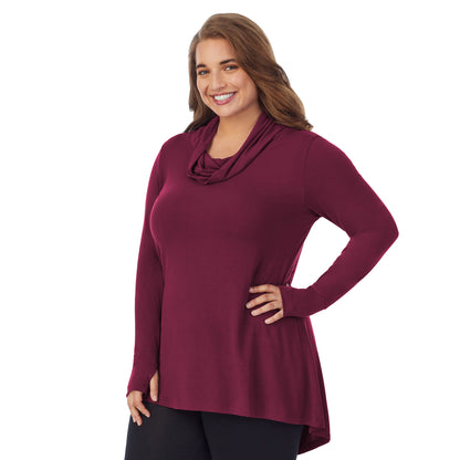 Grape; Model is wearing size 1X. She is 5'7", Bust 42.5", Waist 34.5", Hips 46". @A lady wearing a grape long sleeve stretch cowl tunic plus.