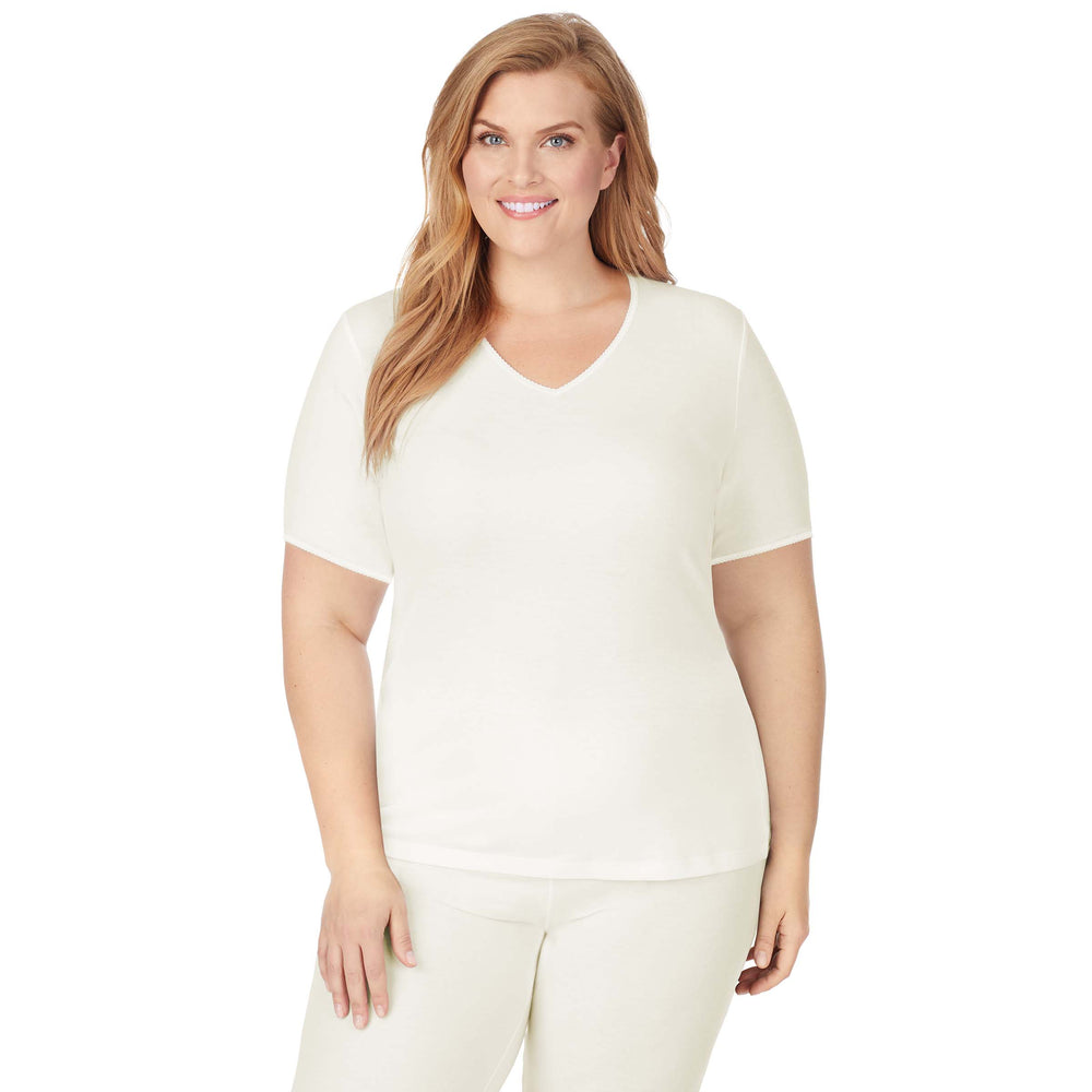 A lady wearing Softwear Lace Edge Short Sleeve V-Neck PLUS in Ivory