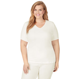 A lady wearing Softwear Lace Edge Short Sleeve V-Neck PLUS in Ivory  